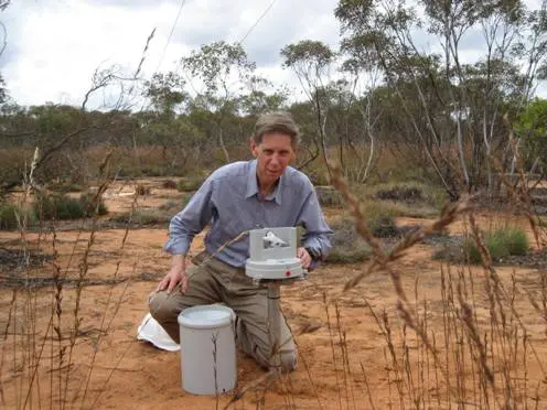 David inspecting the rain gauge